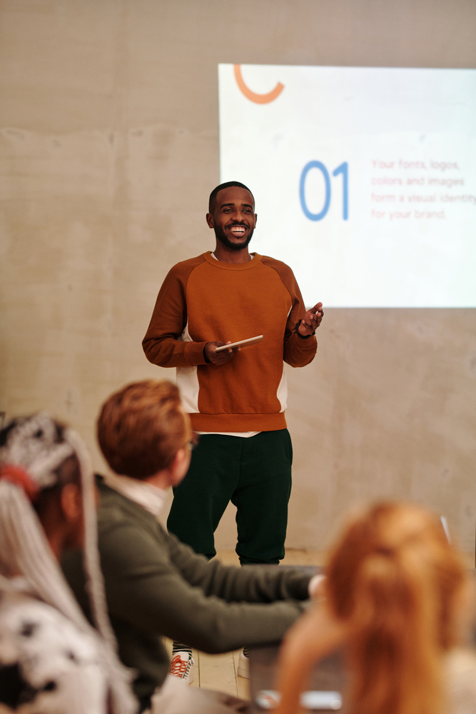 Man Talking In Front of People